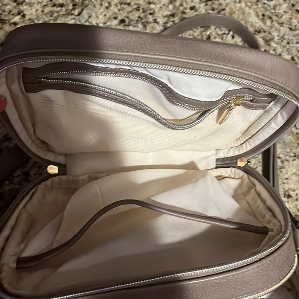 Itzy Ritzy Quilted Crossbody Baby Bag in Taupe